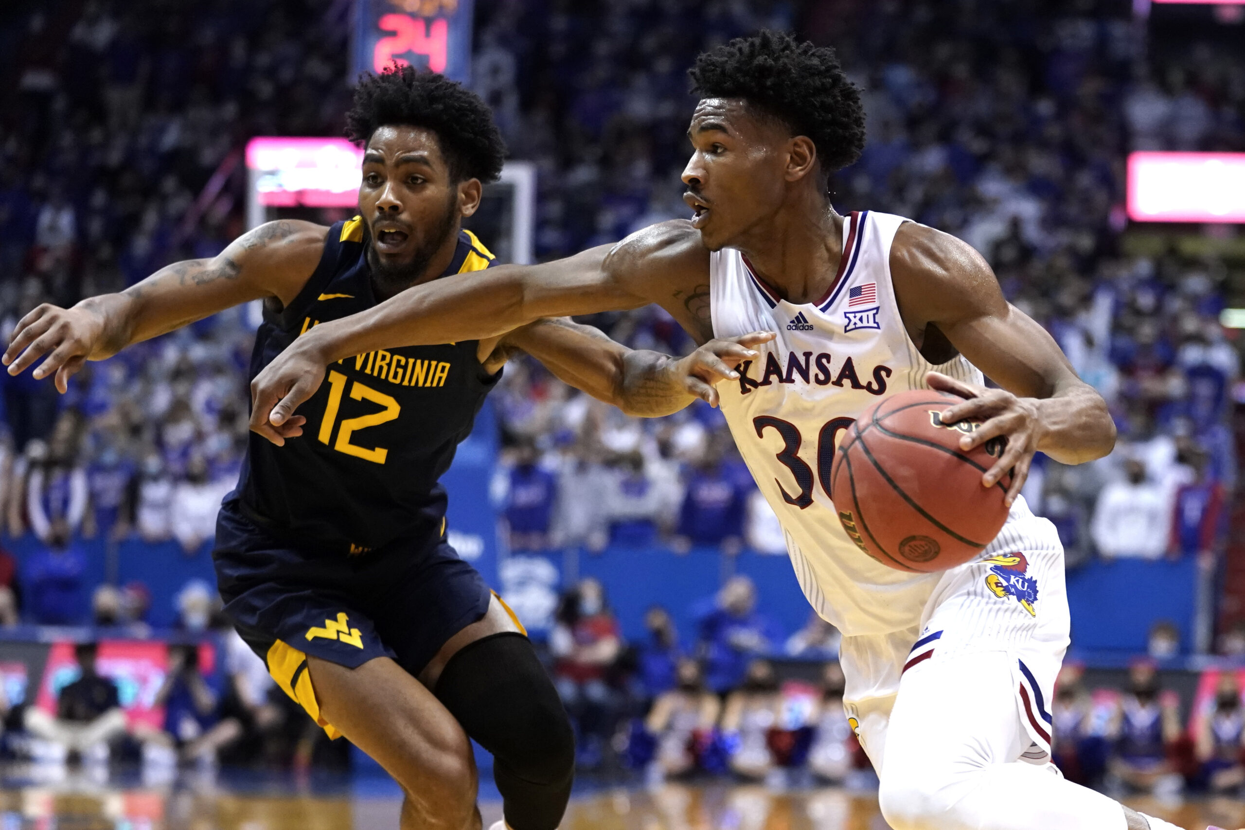 No. 9 Kansas uses big 2nd half to stuff West Virginia 85-59